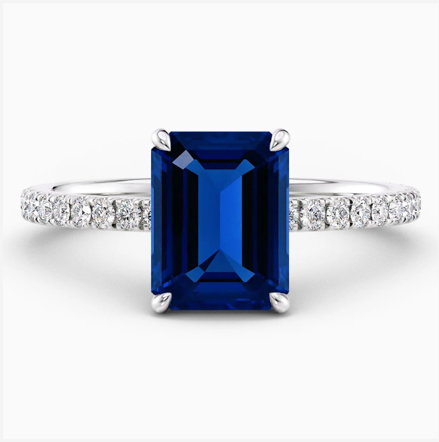 טבעת אירוסין אינדיגו – אבן ספיר כחולה קלאסית בשיבוץ אלגנטי עם יהלומי צד